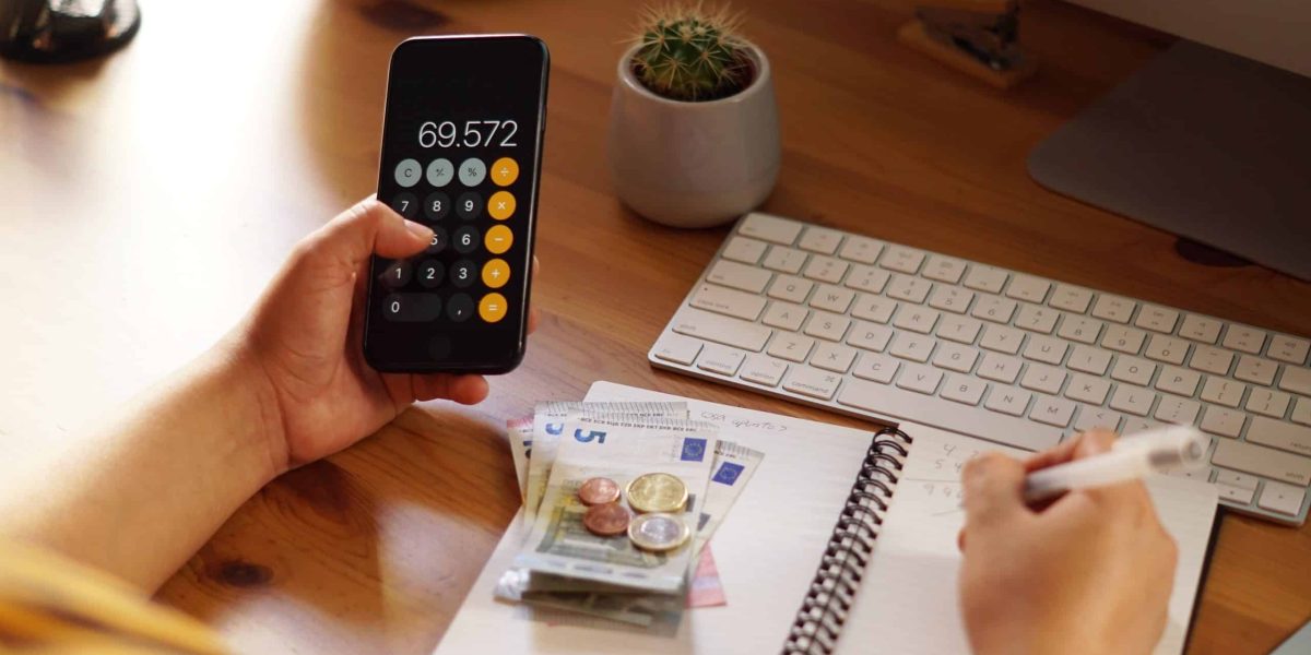 A closeup shot of an entrepreneur working from home on his personal finances and savings