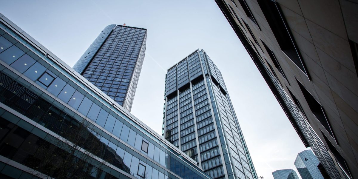 A low angle shot of high rise buildings under the clear sky in Frankfurt, Germany